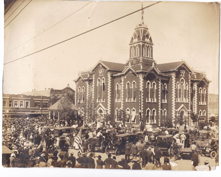 An estimated 5000 citizens gathered at the Hunt County Courthouse in Greenville, Texas on April 21, 1917. Instead of traditionally celebrating San Jacinto Day, when Texas won her independence from Mexico, the crowd eagerly listened to Governor James Ferguson and showed support for President Wilson’s war tactics. Note the enormous American flag on the flagpole atop the copula.